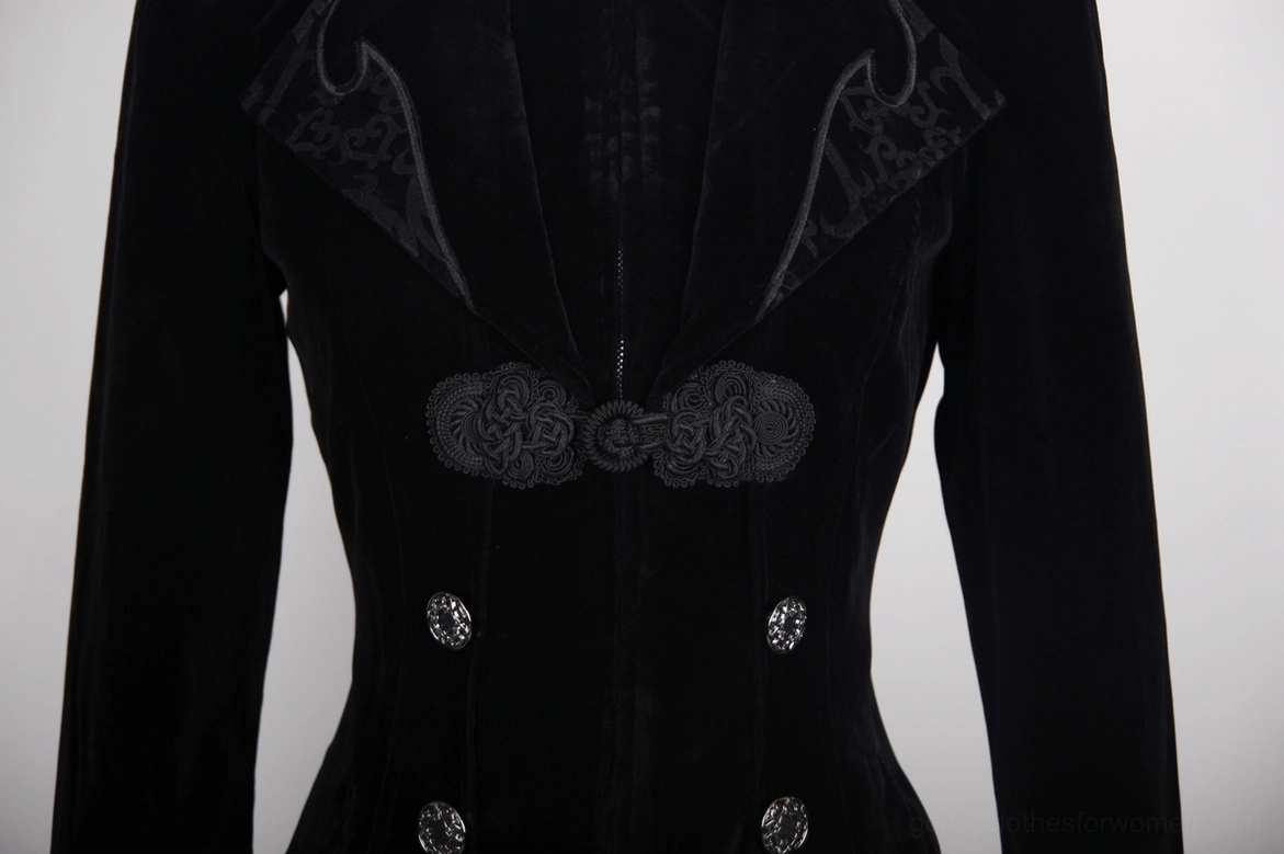 Close-up of black gothic tailcoat front closure detail showing embossed frog fasteners and double metal buttons