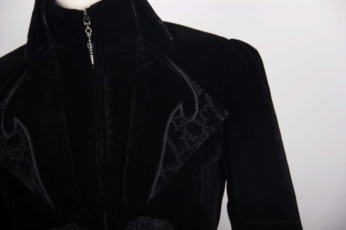 Close-up of black gothic tailcoat lapel placket showing embossed pattern and central zipper closure