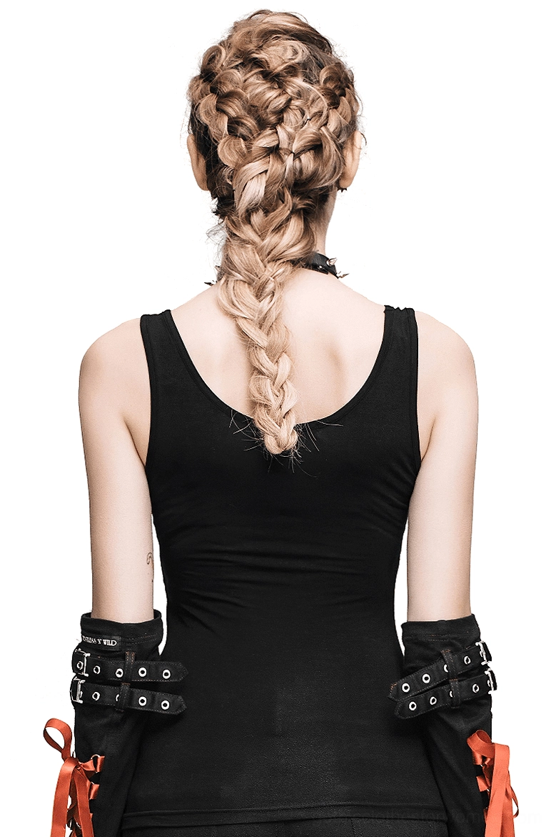Back view of black gothic spike tank top showing low-cut design and studded arm cuffs with orange tie details, worn by model with braided hair