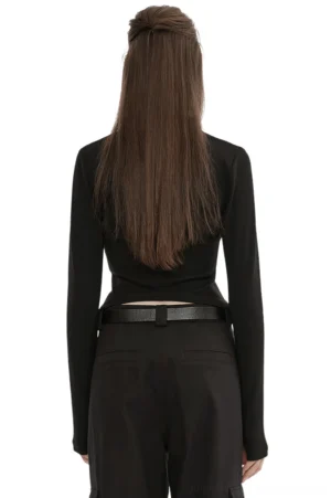 Black gothic long sleeve top rear view on model, exposed back zipper detail, asymmetric curved hem, ribbed knit fabric close-up