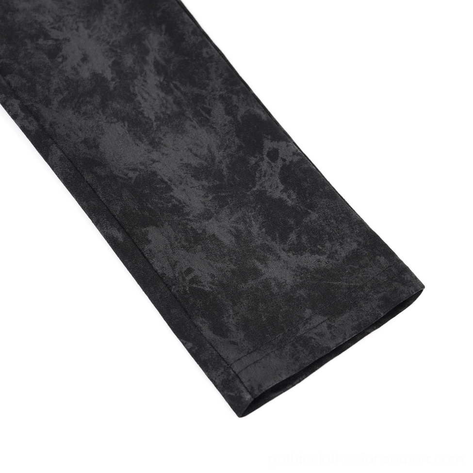 Black gothic trousers side view showing patent leather pocket hardware and buckle details