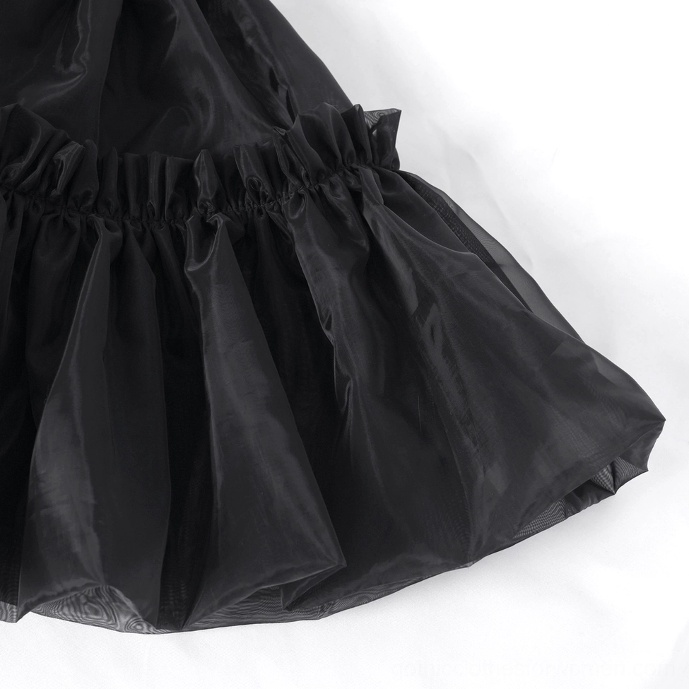 Side close-up of black gothic tulle skirt panels displaying shiny tulle fabric and layered ruffle construction