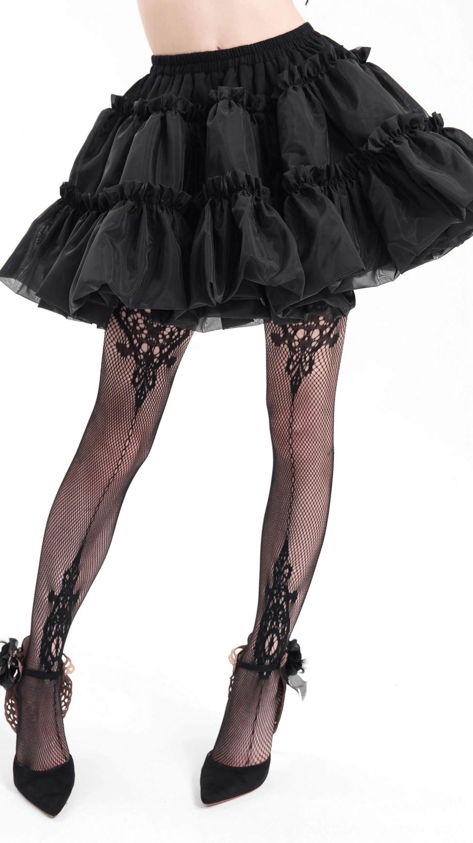Black layered gothic tulle skirt detail emphasizing tiered ruffles and ethereal sheer fabric layers