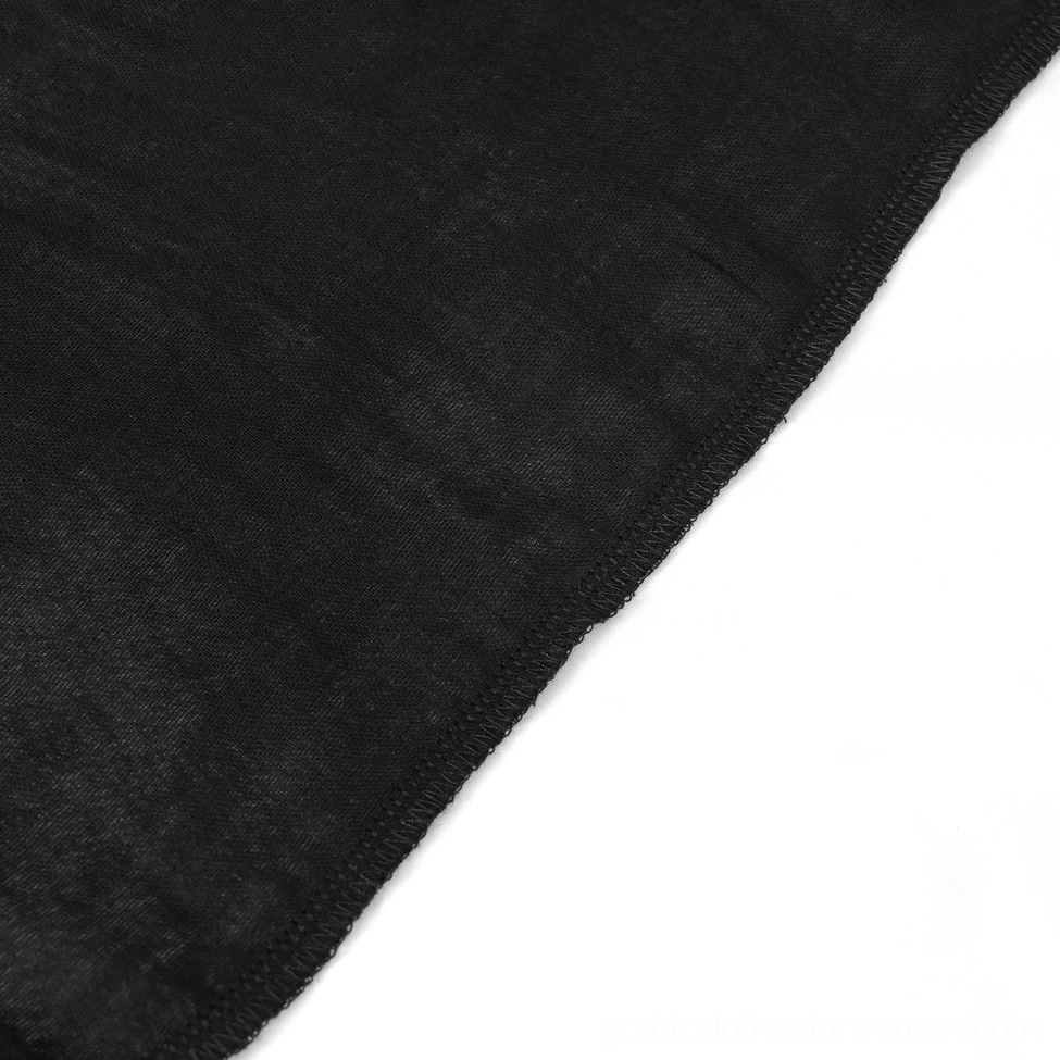 Flat lay close-up of black gothic tulle skirt lining showing dense woven textile and clean professional stitching