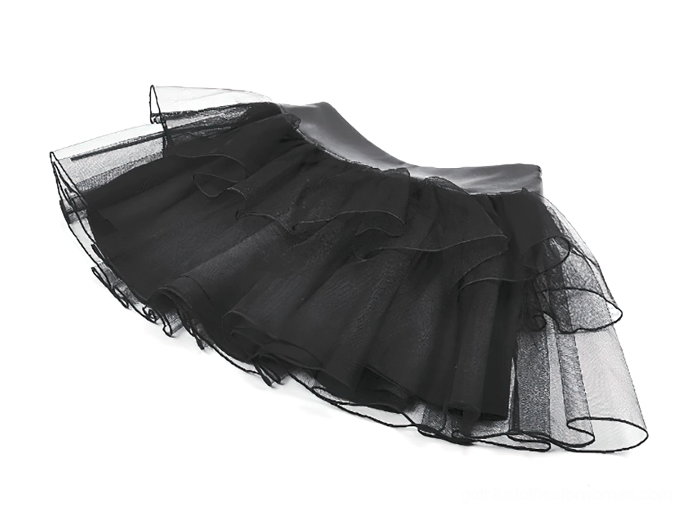 Black gothic tulle mini skirt oblique side view displaying ruffled tulle layers and dramatic silhouette