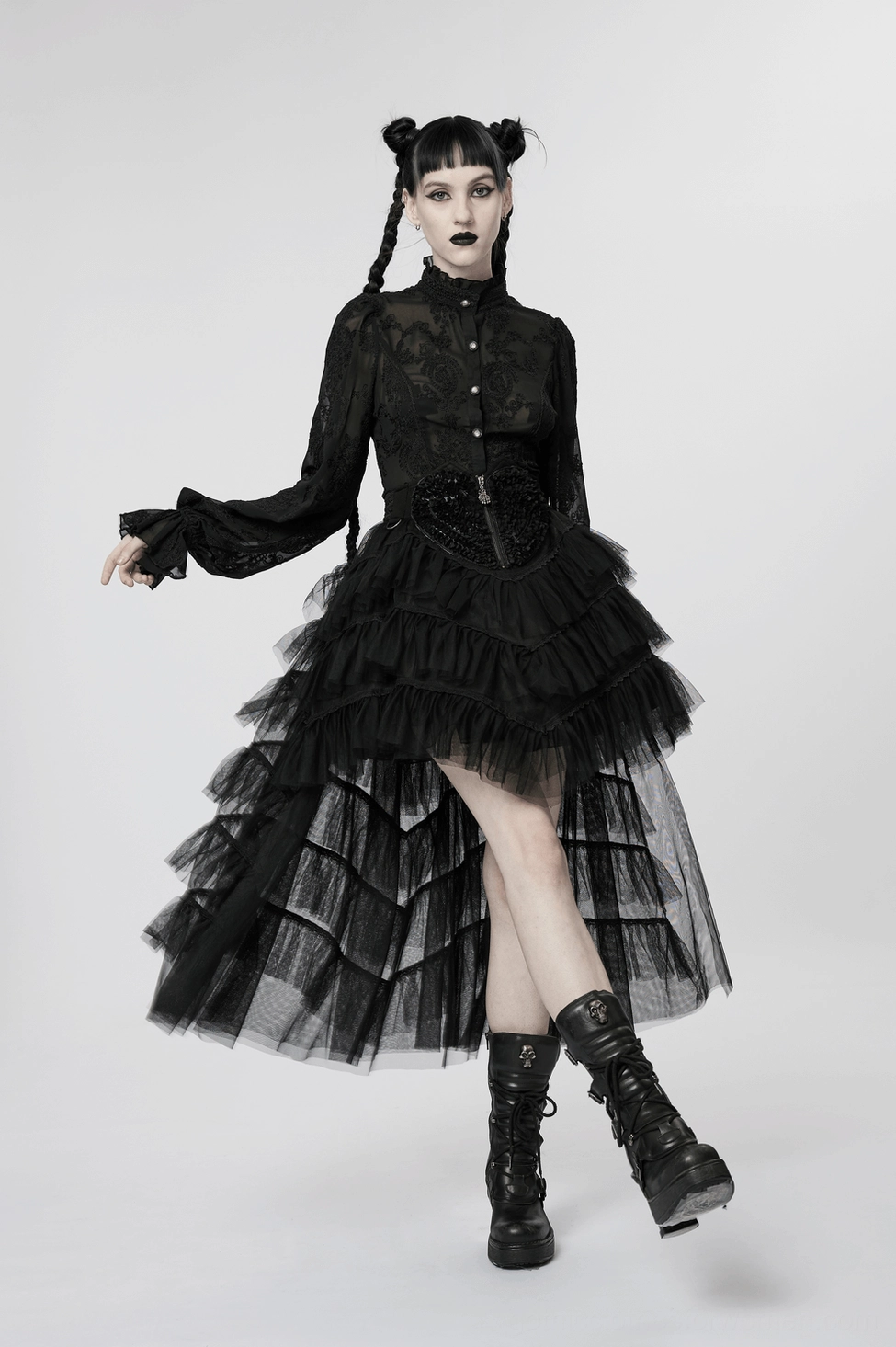 Black gothic tulle skirt showing peach embroidered accent patch and tiered ruffle construction