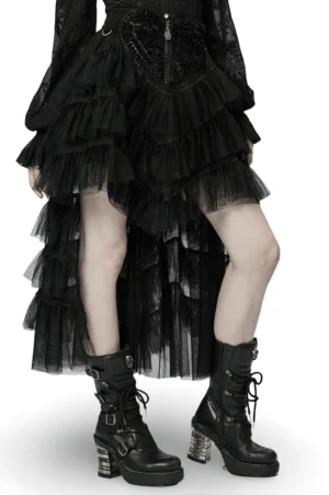 Black gothic tiered tulle ruffle skirt with skeleton hand zipper front three-quarter view on model