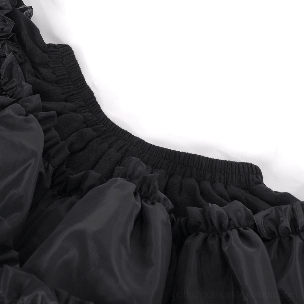 Close-up top-down view of black tulle skirt waist showing elastic gathered construction and ruffle tier details
