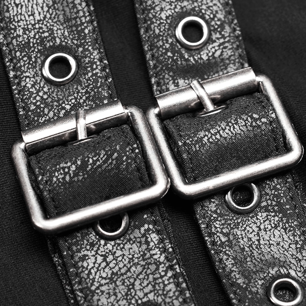 Close-up detail of distressed faux leather shoulder strap hardware on black gothic turtleneck