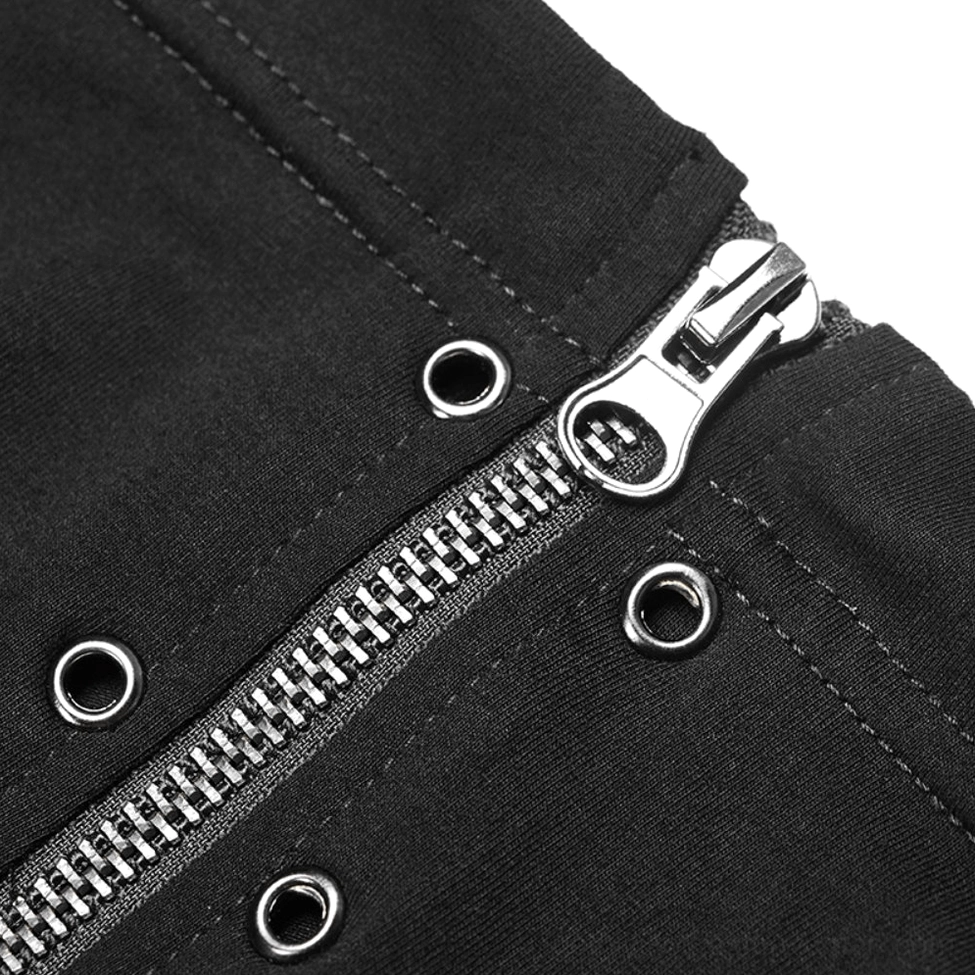 Close-up detail of asymmetrical zipper and metal eyelets on black gothic turtleneck top