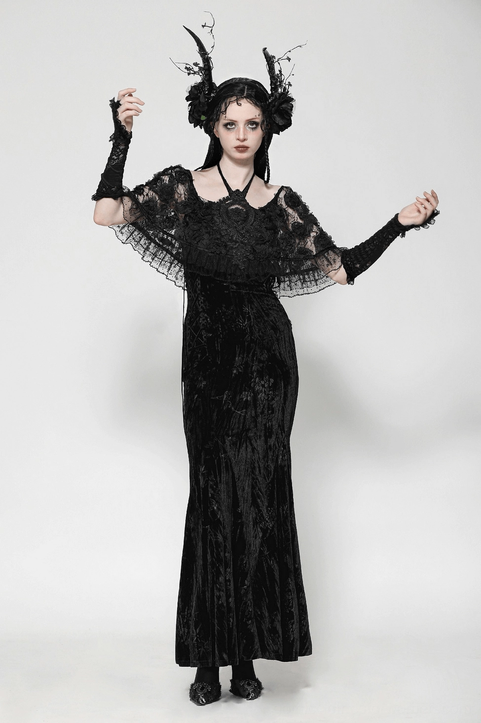 Black gothic velvet dress with lace cape and ruffled hem construction detail