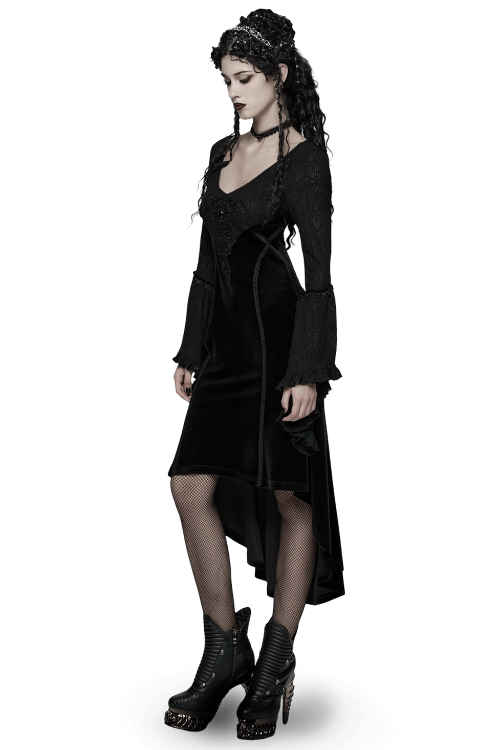 Black gothic velvet high-low dress side profile showing asymmetrical hem, sheer stockings, and platform boots worn by goth model