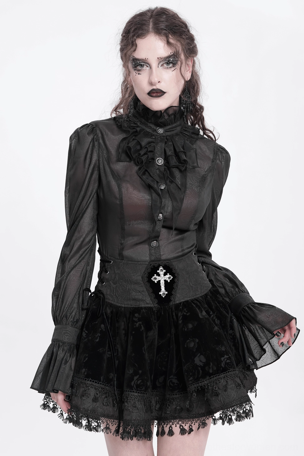 Black gothic velvet skirt fashion model shot showing complete look with embroidered cross waist embellishment and flowing ruffled hem
