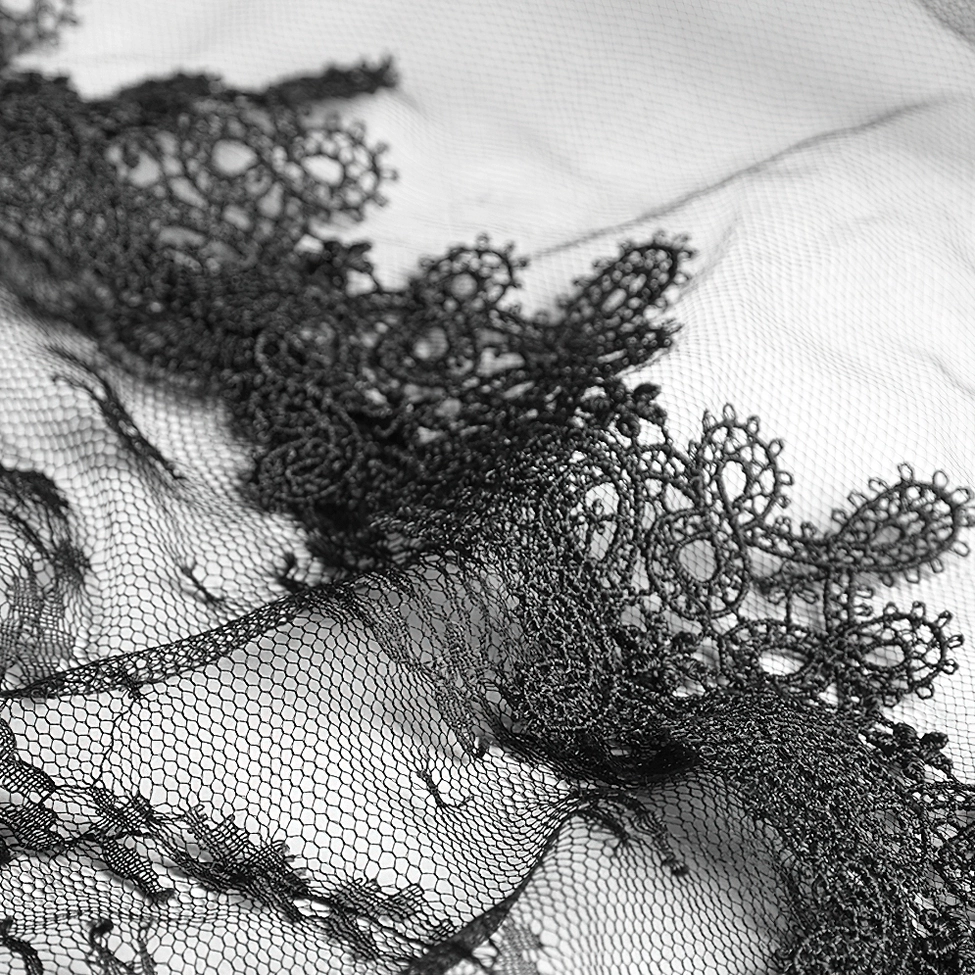 Black gothic lace wedding veil with intricate rose and feather embellishments showcasing alternative bridal design