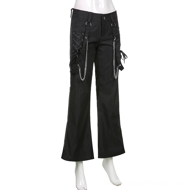 Women's black gothic cargo trousers on mannequin, front full-body view highlighting metal chain and lace-up pocket details and wide-leg design
