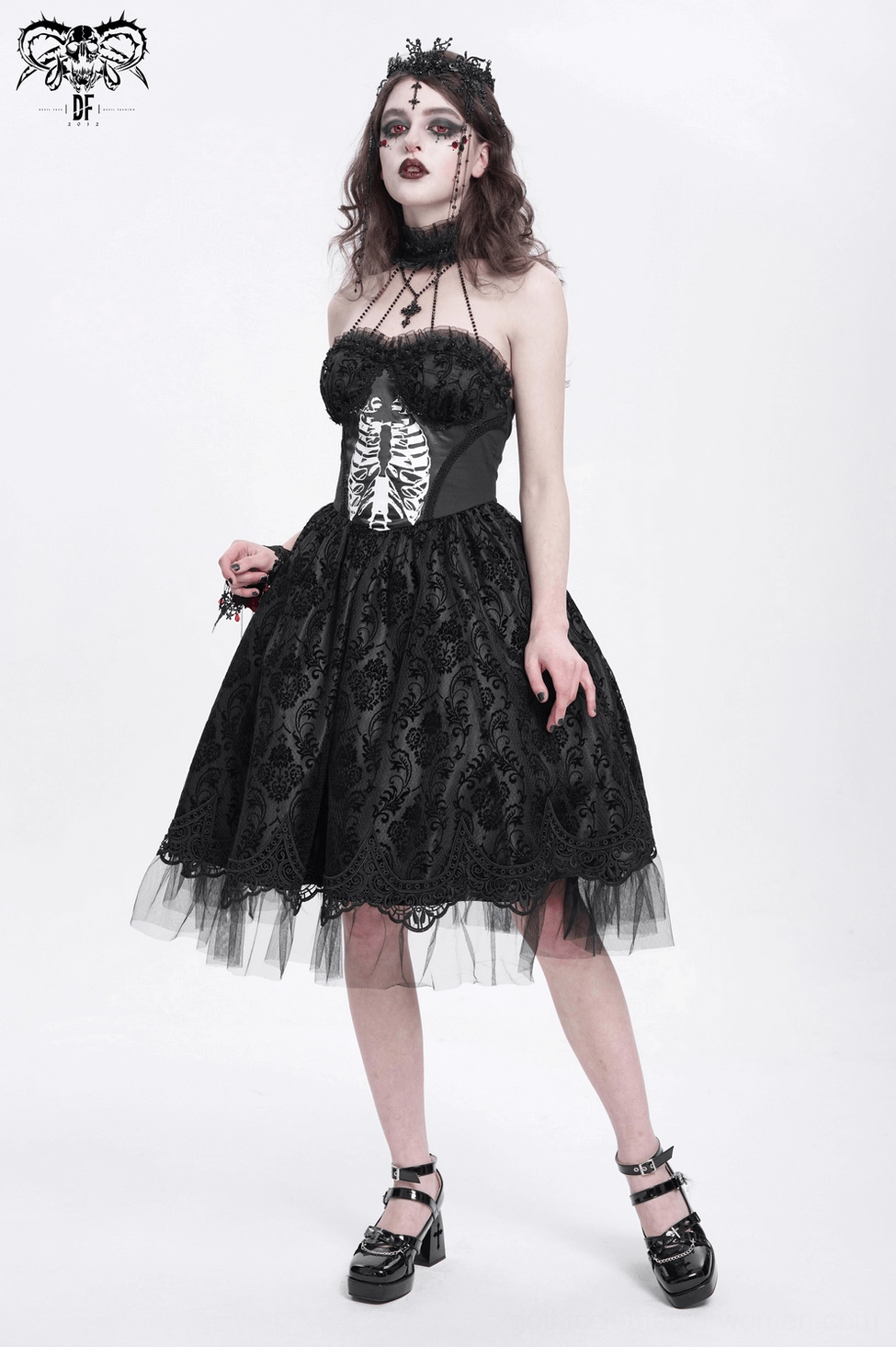 Black halter gothic dress detail view of bodice, lace overlay, and anatomical ribcage print design