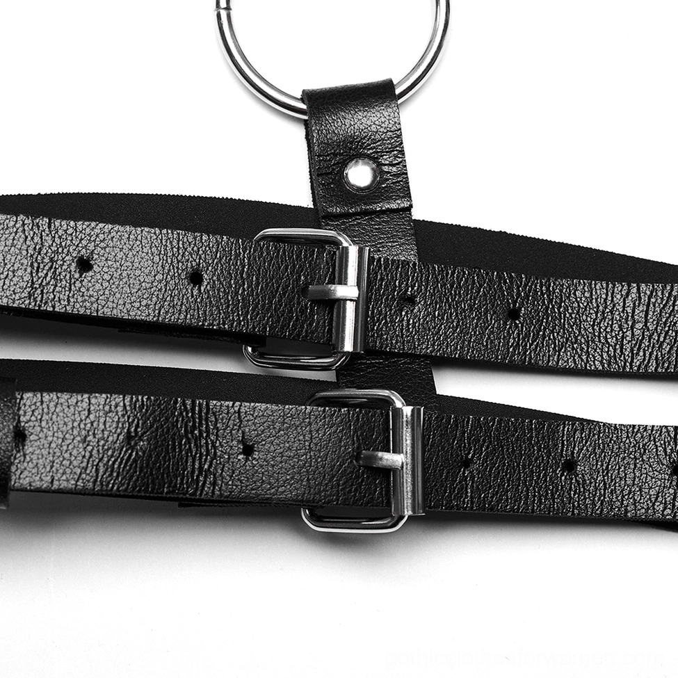 Black leather body harness construction detail - adjustable strap mechanism and metal hardware assembly