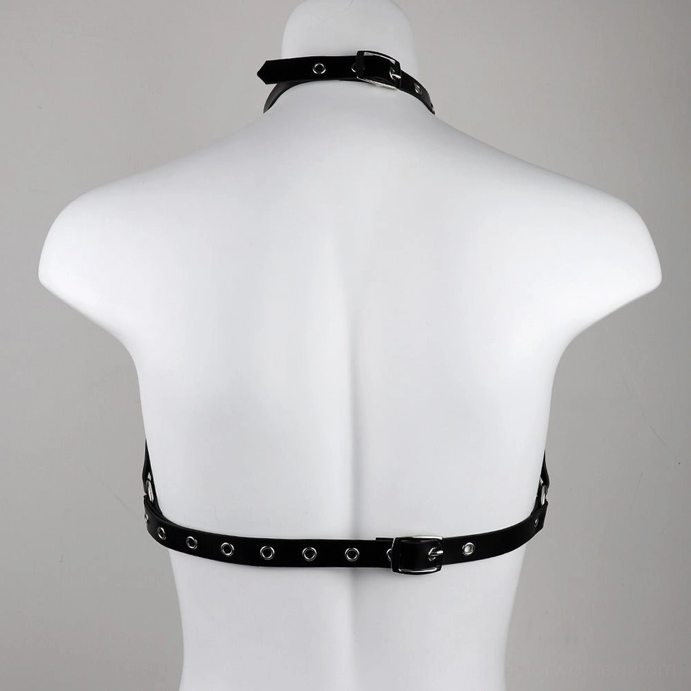 Back view of adjustable black leather chest harness on mannequin torso, featuring eyelets, back closure buckle, and neck collar design