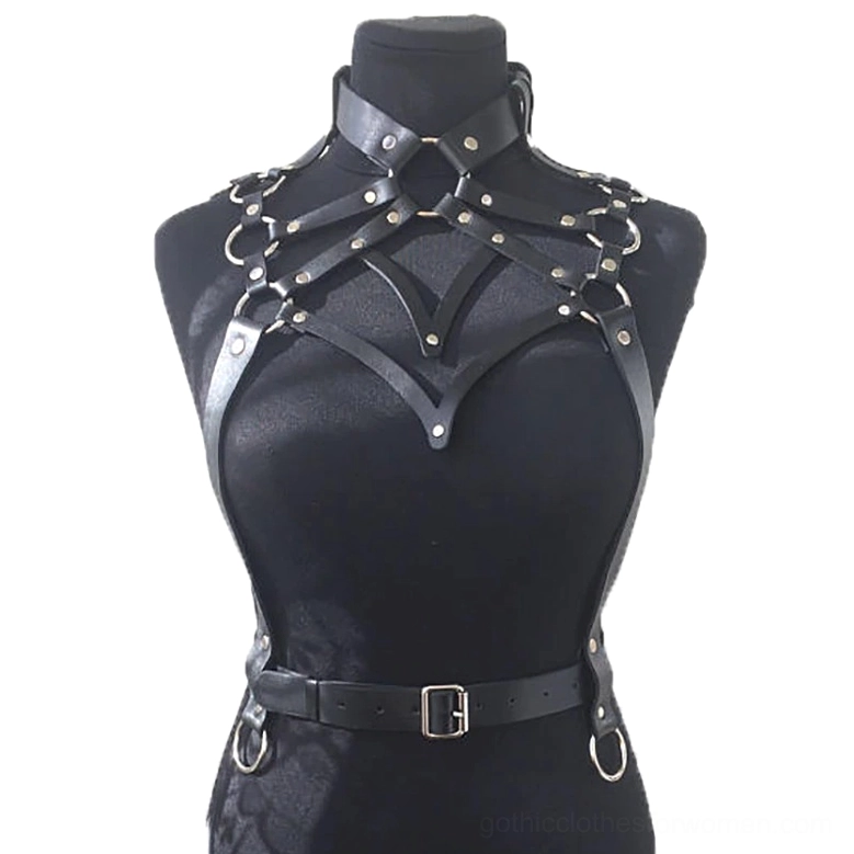Black synthetic leather body harness front three-quarter view - V-shaped chest design with metal hardware detail visible on dress form