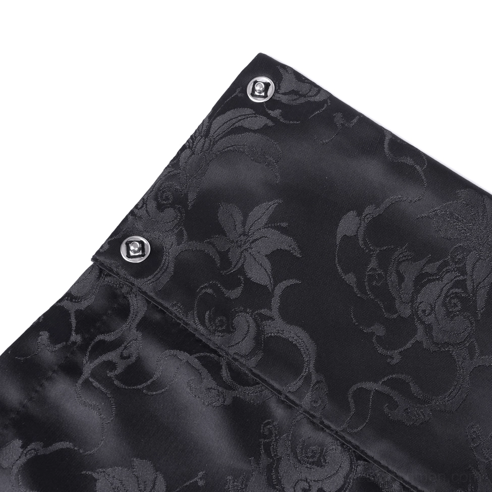 Fabric close-up of black jacquard gothic skirt showing floral vine patterns, silver embroidery and metal snap button details