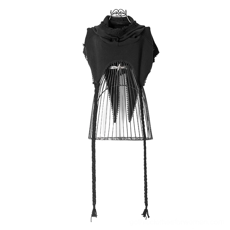 Black hooded knit cape on dress form showing cutout mesh back panel, braided long drawstrings, and frayed hood edges from front