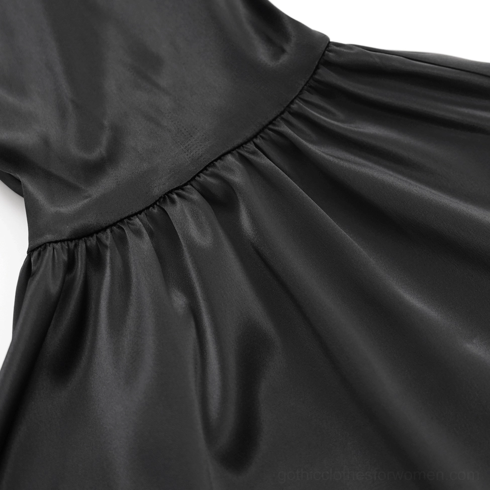 Full-length front view of black lace bell-bottom gothic pants displaying fitted silhouette and intricate overlays