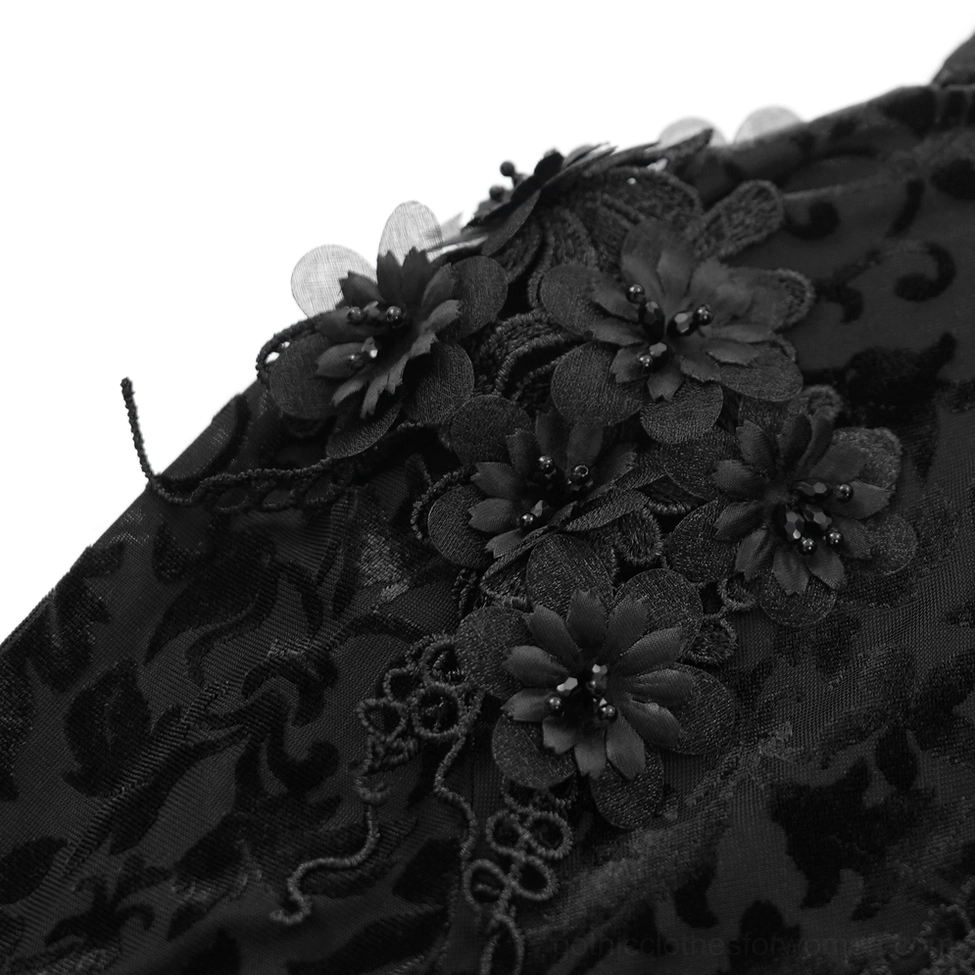 Black lace bolero fabric texture close-up showing 3D embroidered floral details and burnout velvet intricate craftsmanship