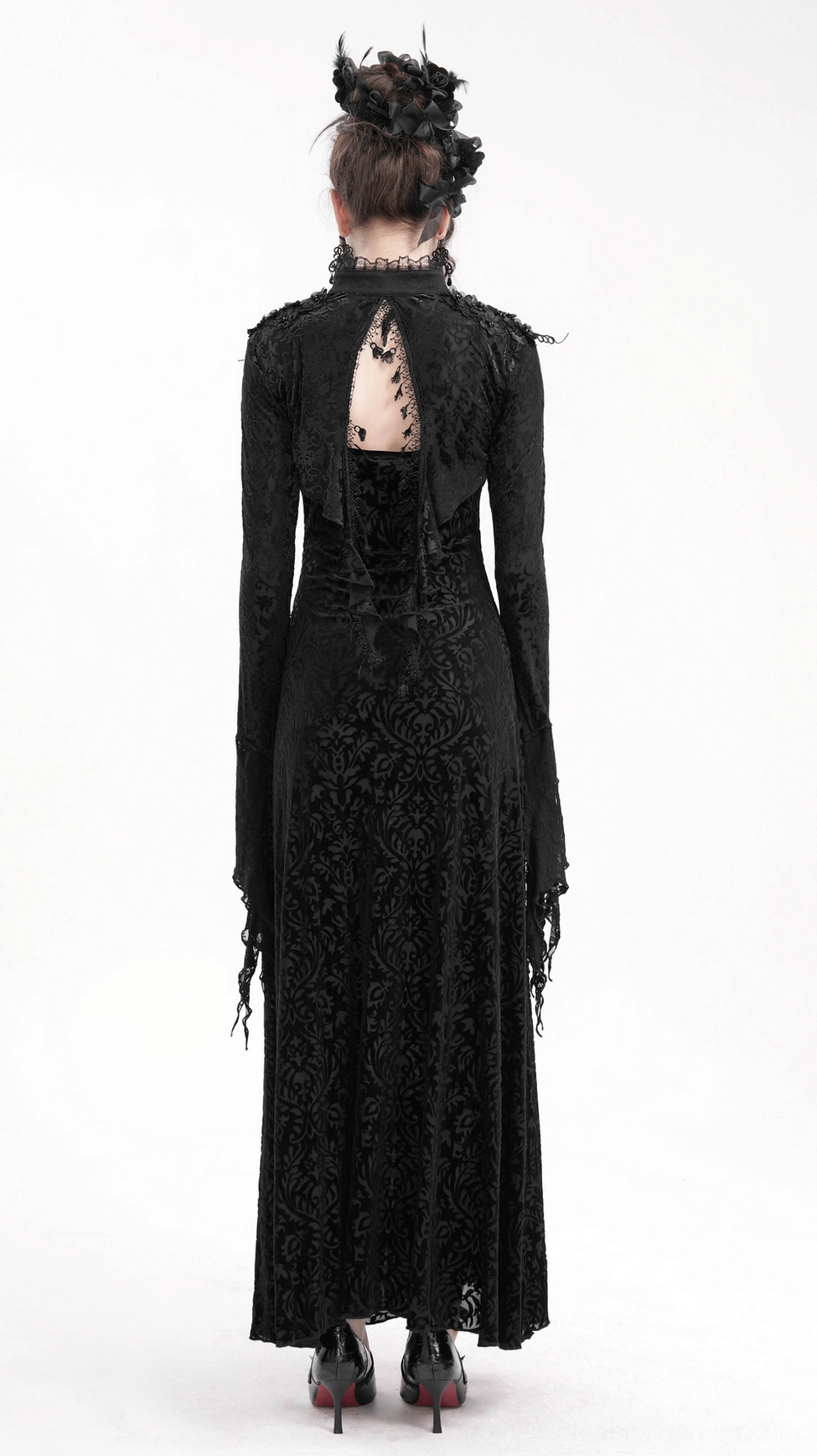 Black lace bolero with bell sleeves side profile view on model showing depth and volume of dramatic sleeve design
