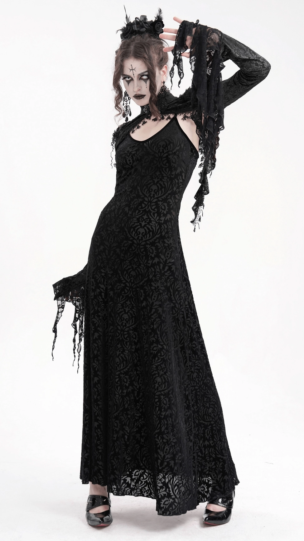 Black lace bolero sleeve cuff detail close-up showing bell sleeve construction, tassel embellishments, and lace texture