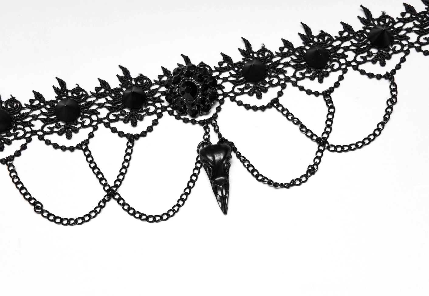 Front flat lay view of black lace choker necklace with central bird skull drop pendant and chains