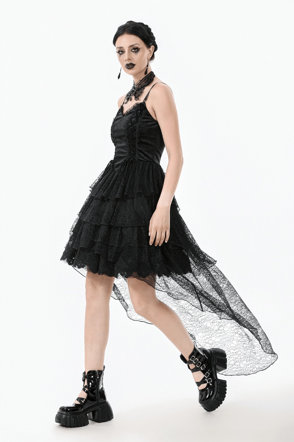 Model in black lace gothic corset dress demonstrating fit and movement of tiered skirt layers