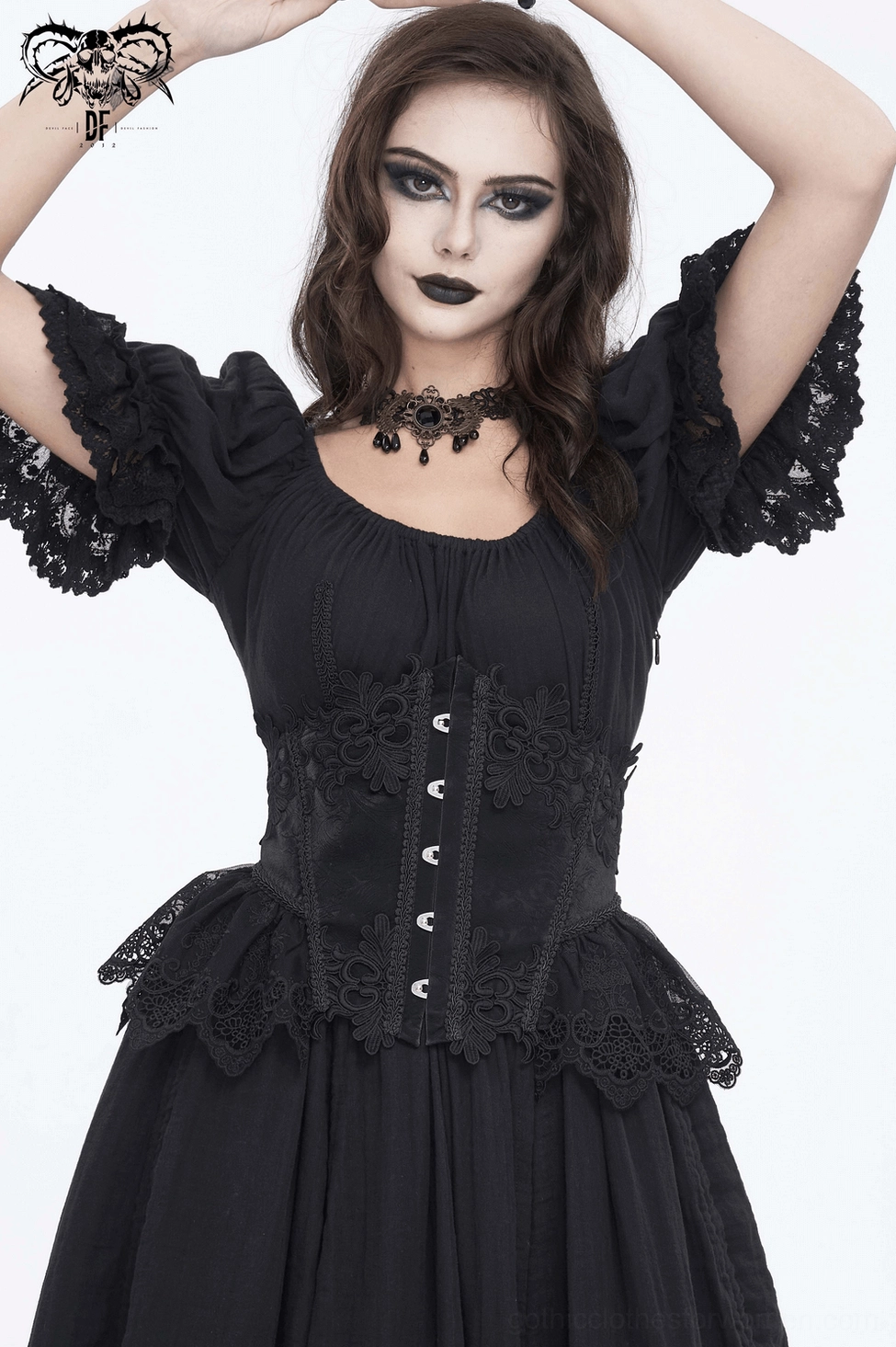Side profile of gothic model wearing black lace underbust corset demonstrating the waist-cinching effect and silhouette