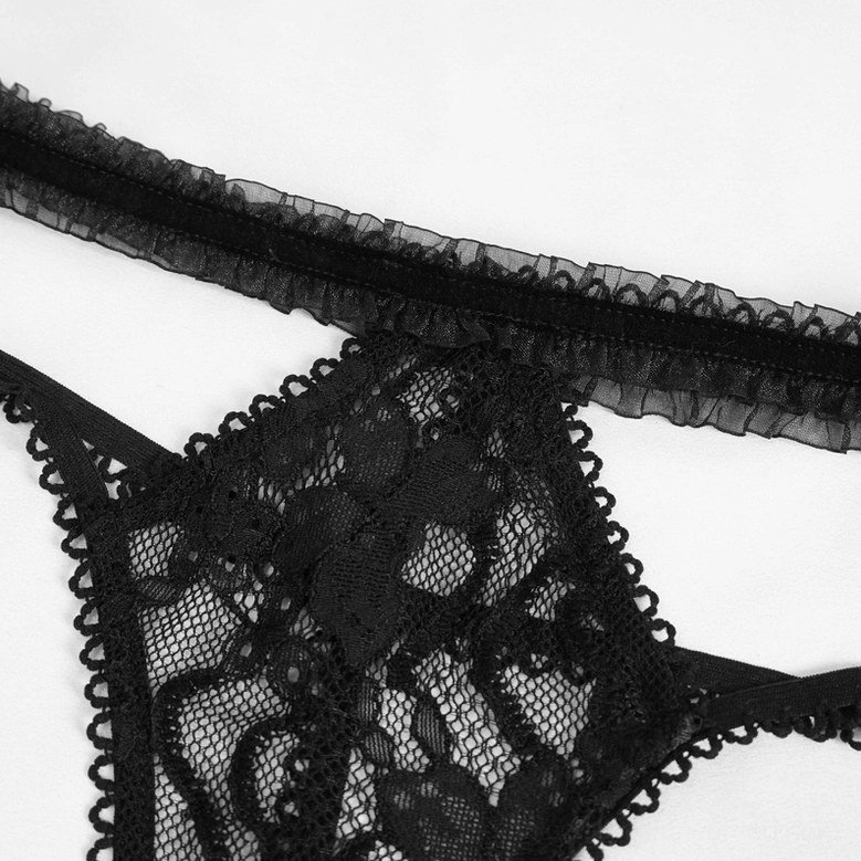 Close-up detail of black lace fabric showing scalloped lace edge and ruffled elastic trim texture on gothic lingerie