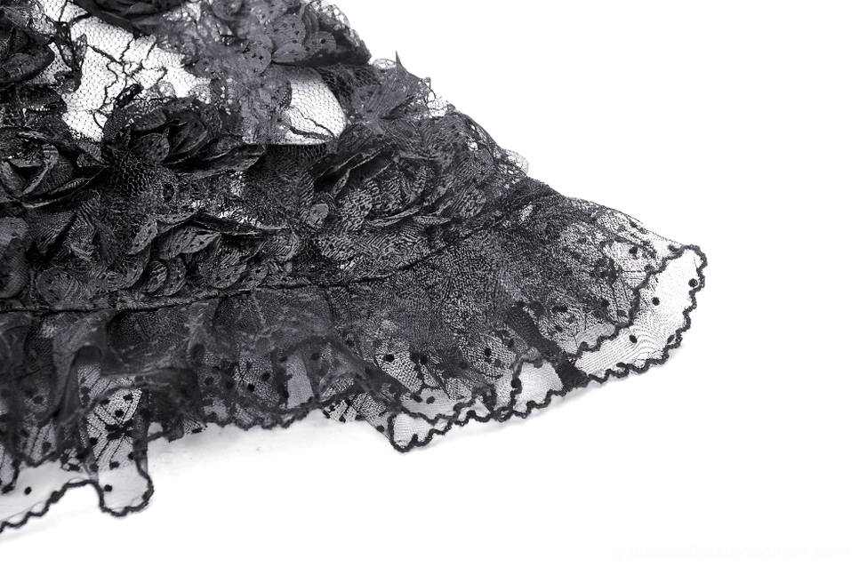 Black lace fabric texture close-up with scalloped ruffled hem and 3D floral appliqué detail