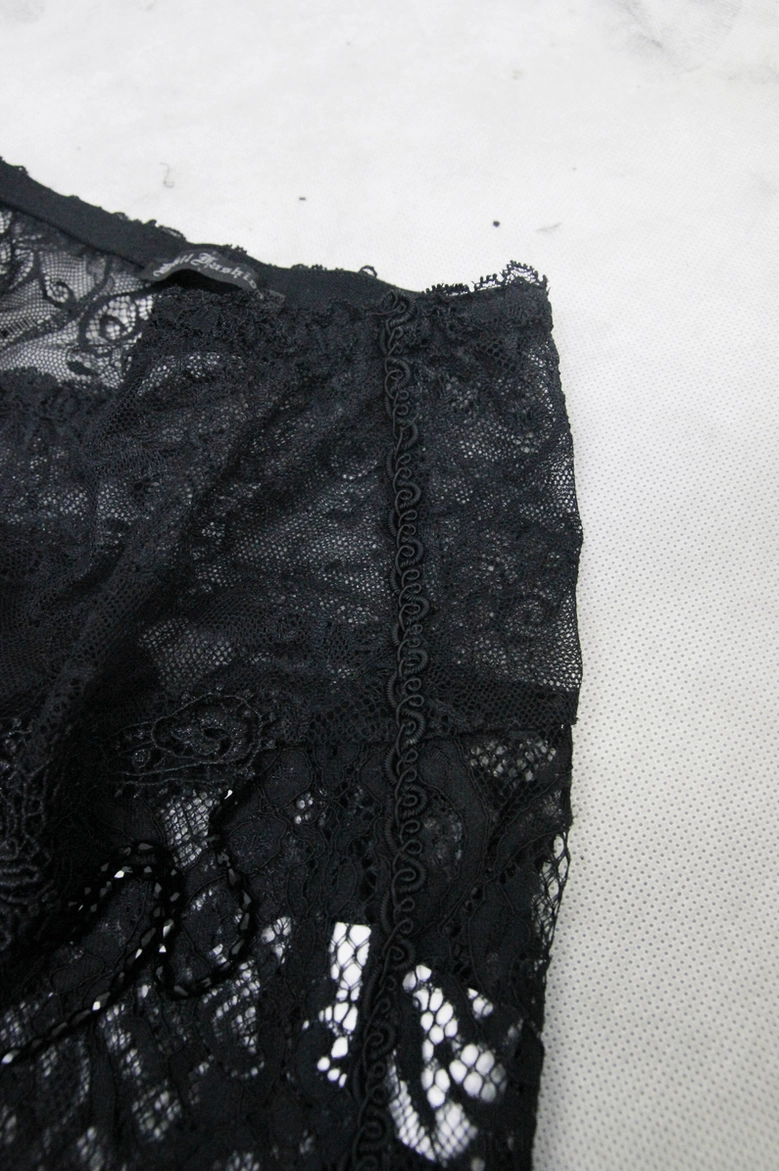 Black lace flare pants side seam detail – sheer mesh construction and stitch trim
