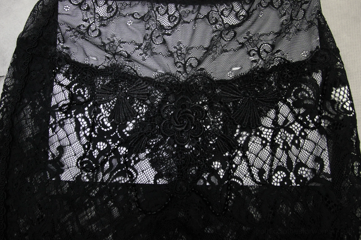 Black lace flare pants waist detail – close-up of scalloped waistband and floral lace pattern