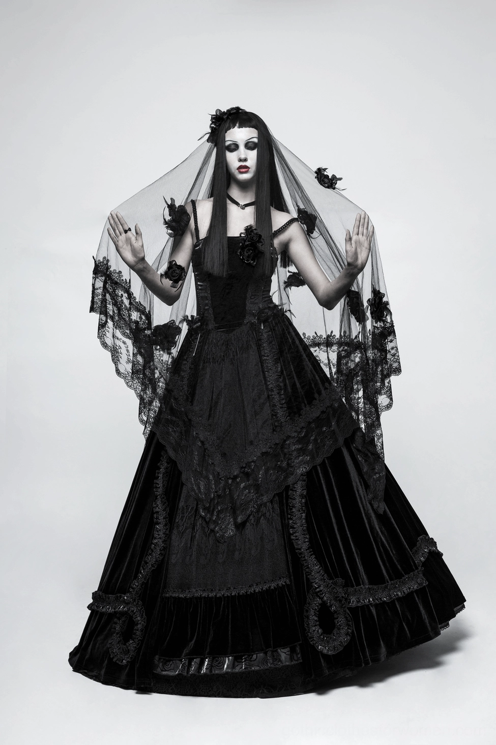 Black lace gothic bridal veil with 3D floral accents and elegant draping displayed in studio setting