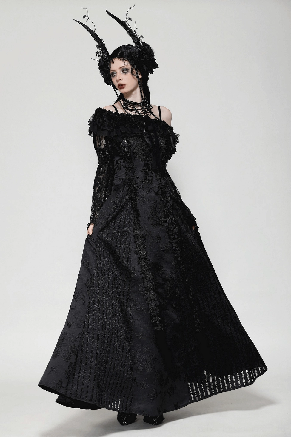 Gothic black lace cape styled on model with alternative fashion aesthetic and goth accessories