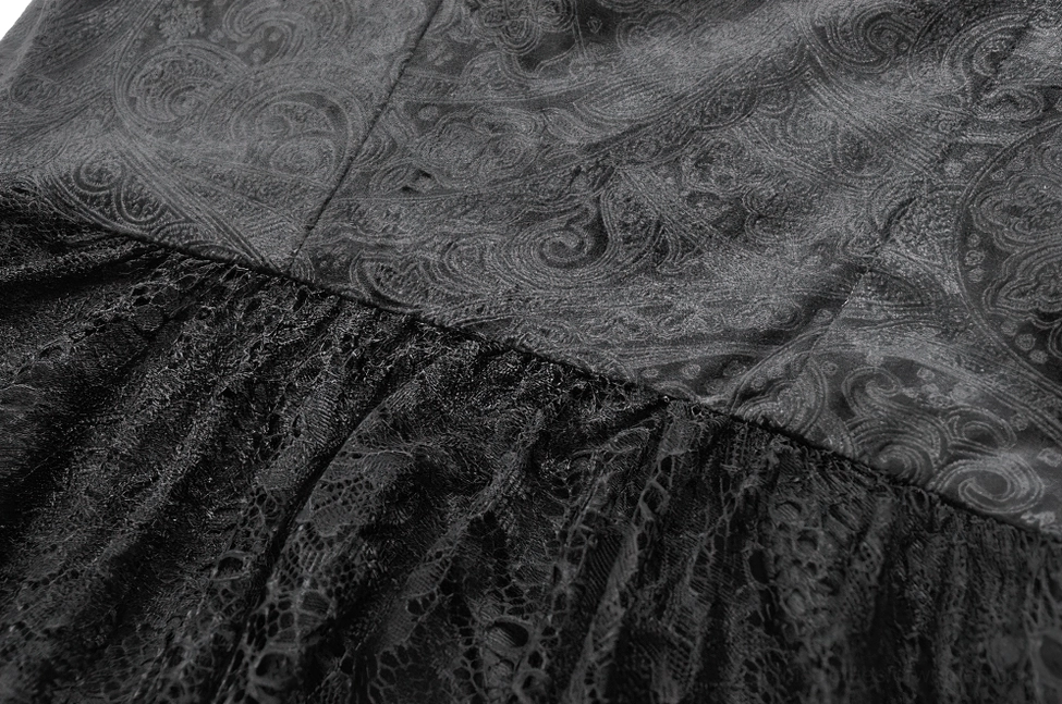 Fabric texture detail of black lace gothic dress with paisley pattern lace overlay and matte finish