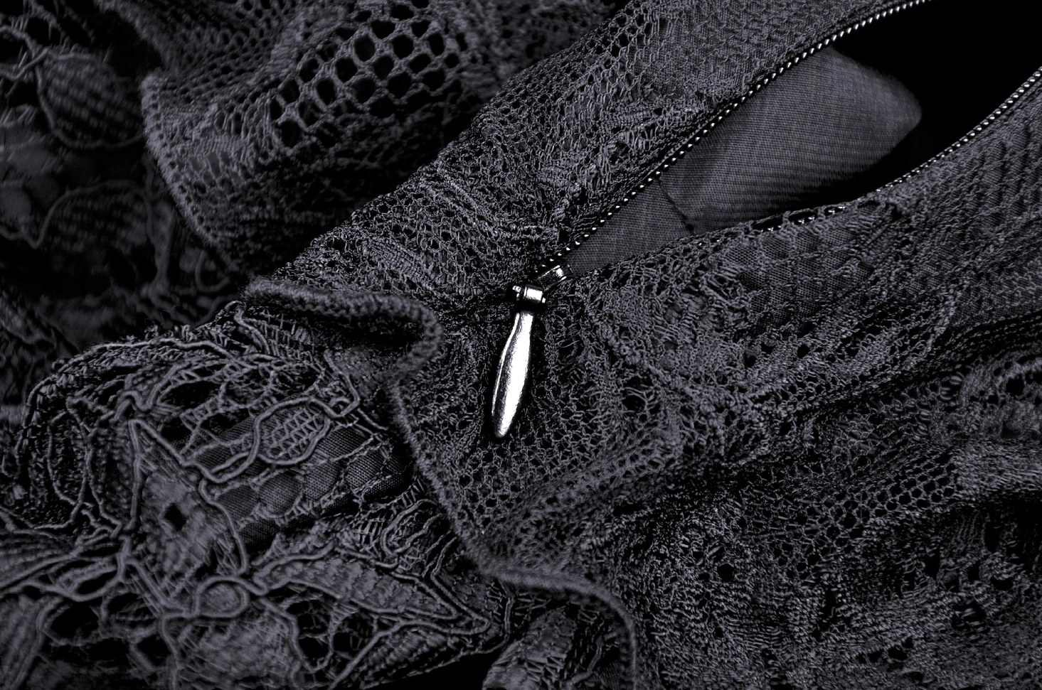 Black lace gothic dress side profile showing silhouette and handkerchief hem construction