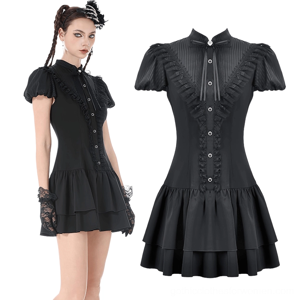 Black gothic mini dress three-quarter front view showing decorative ruffled placket, puff sleeves, and lace gloves on model with braided hairstyle