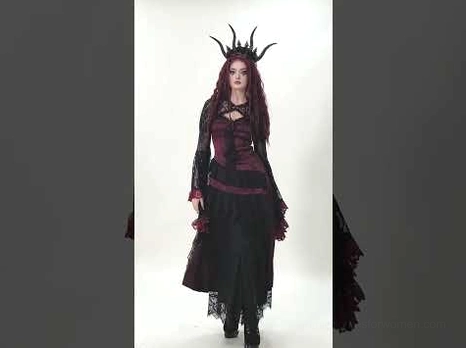 Complete gothic outfit featuring black lace shrug layered with corset top and flowing skirt, full costume styling