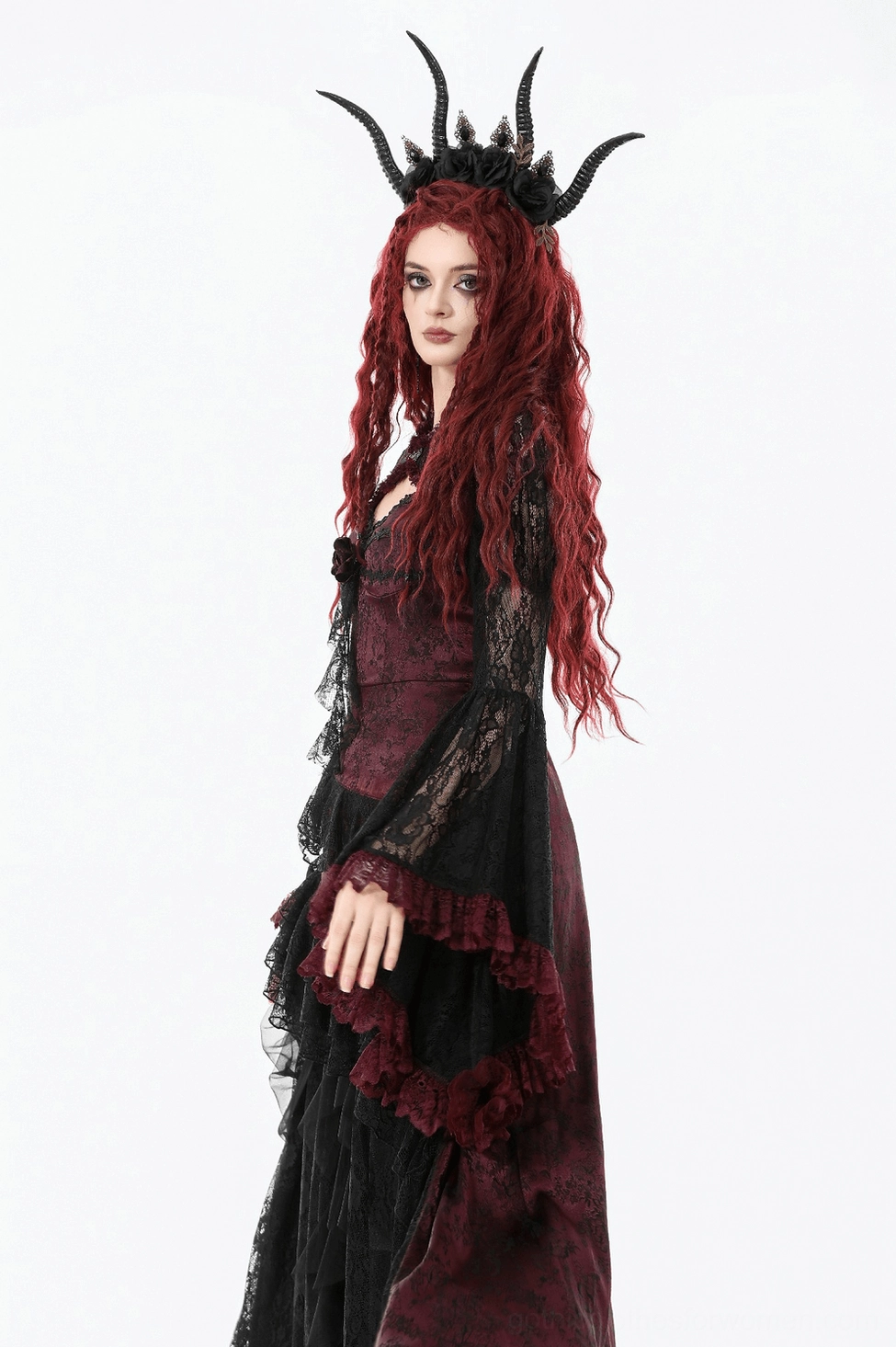 Black lace gothic shrug with dramatic bell sleeves and wine-red ruffled trim, studio lighting detail