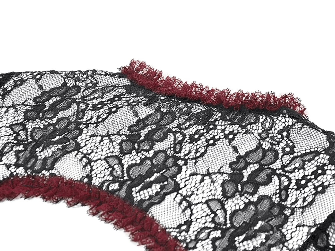 Detailed close-up of black floral lace fabric with wine-red ruffled edge trim on gothic shrug