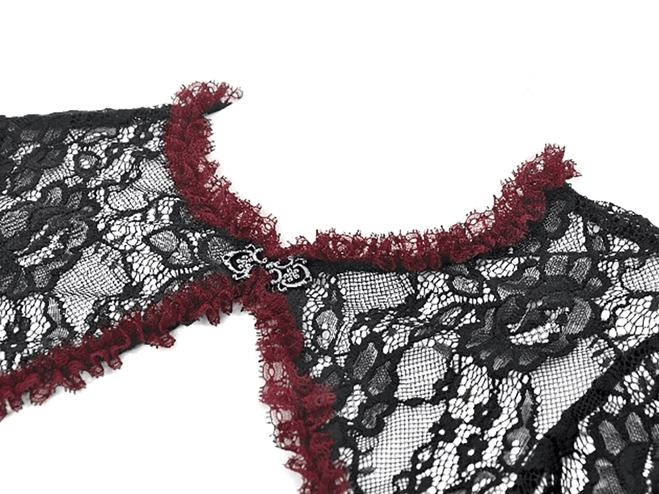 Close-up detail of black lace shrug neckline with metal decorative clasp and wine-red ruffled trim