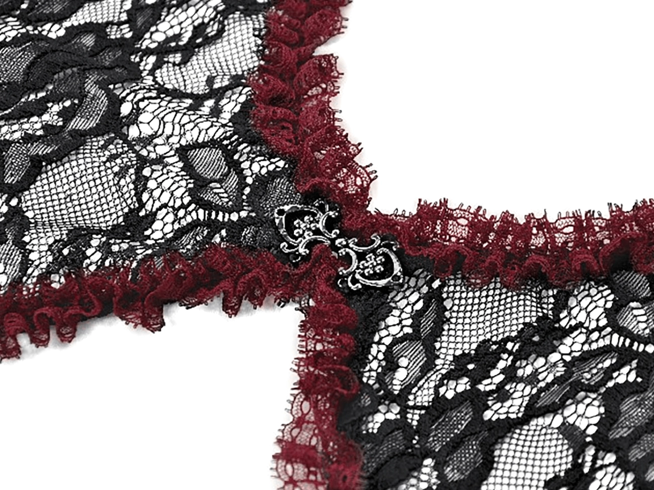 Black lace shrug detail shot highlighting semi-sheer floral lace construction and ruffled trim texture