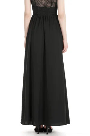 Black gothic lace maxi skirt back view, displaying smocked high waistband, scalloped lace hem, and elegant back design