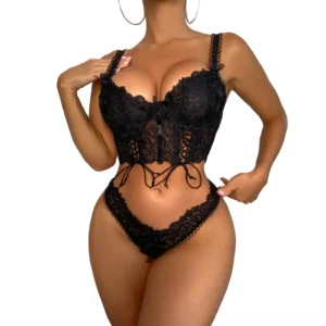 Black lace gothic lingerie set front three-quarter view with crisscross tie-up and floral lace pattern
