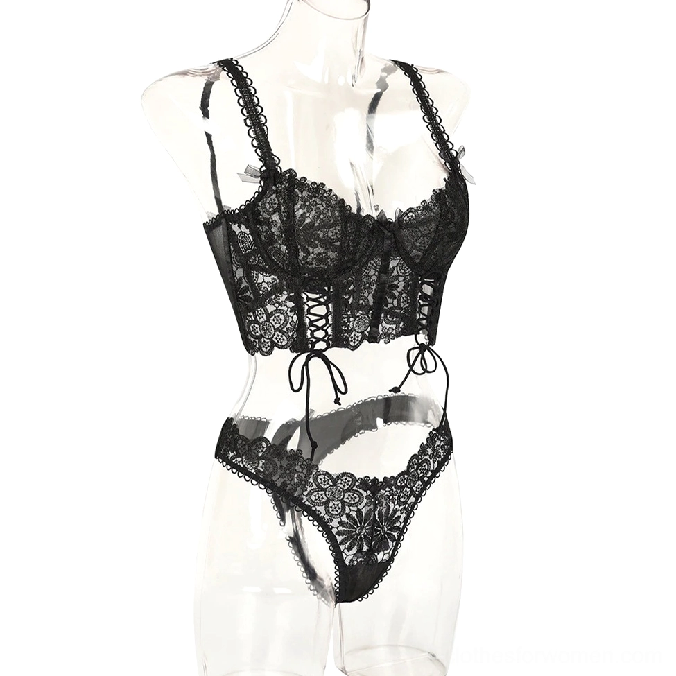 Black gothic lace lingerie on mannequin with spaghetti straps and adjustable front ties