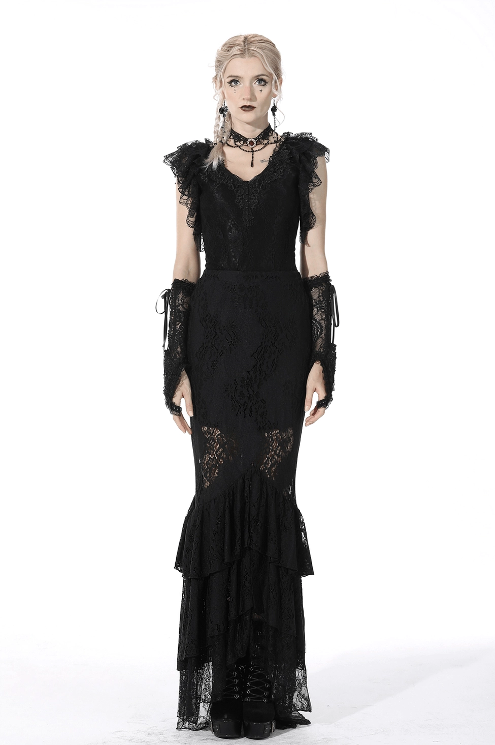 Black lace mermaid skirt on model showing fishtail silhouette and dramatic asymmetrical ruffle layering from side angle